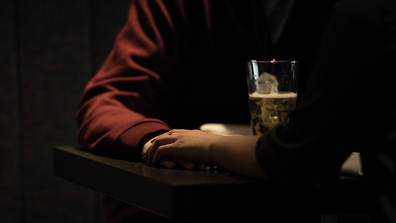 man-observing-stoma-pouch-on-his-abdomen-thinking-about-body-image-concerns-with-a-stoma